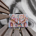 Meadow Blossom Sequin Envelope Sling Bag by Suryatra