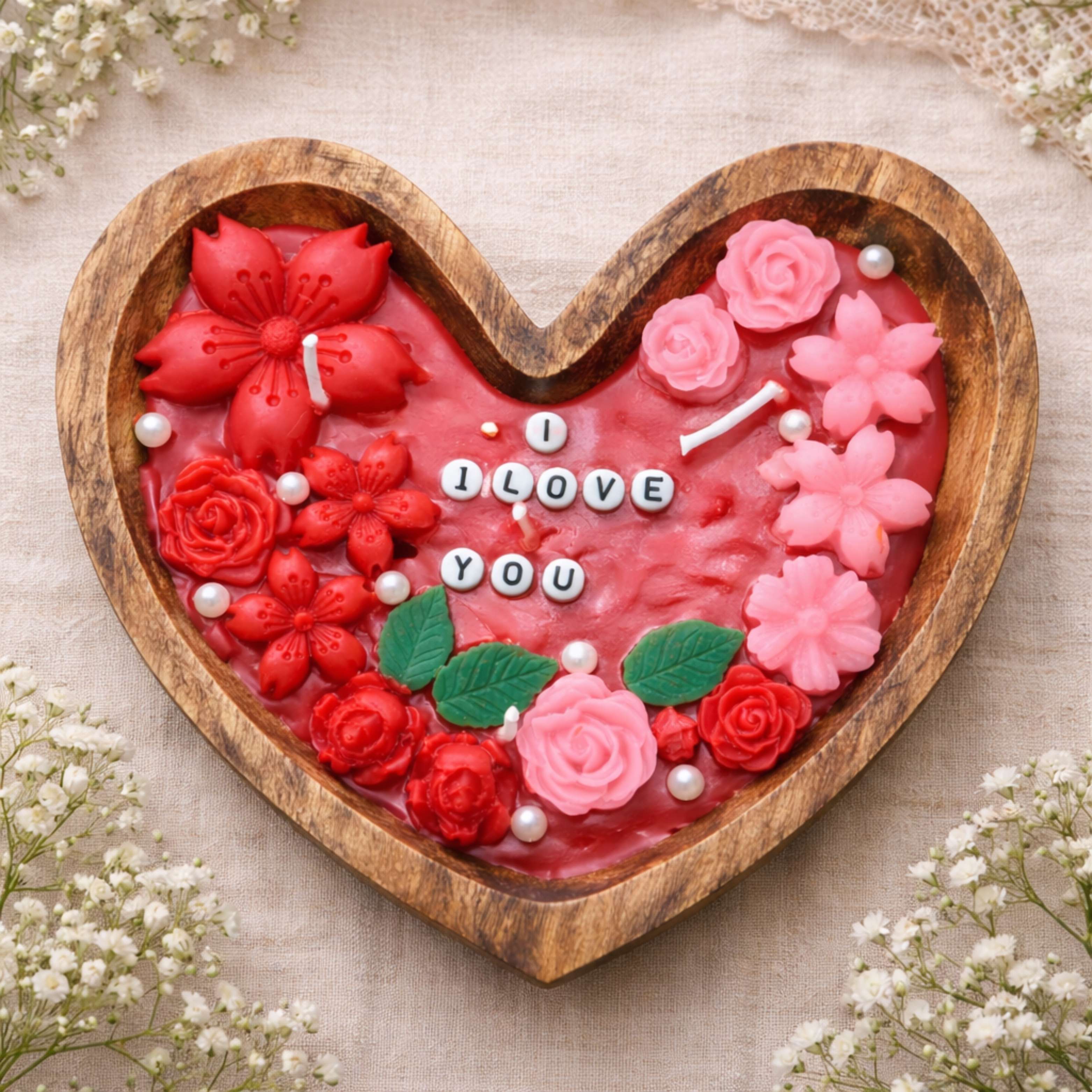 Romantic heart-shaped candle filled with blooming flowers by Suryatra