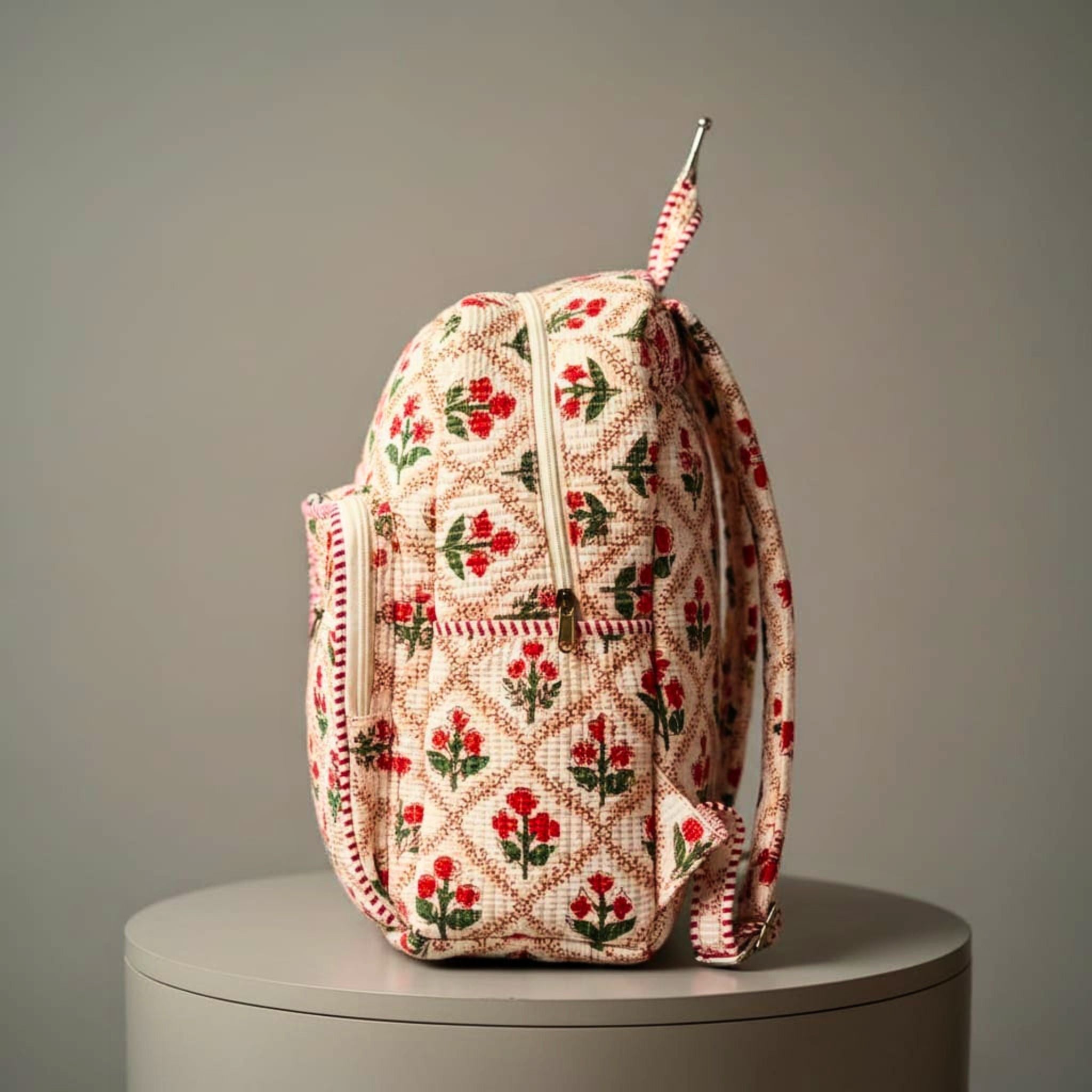 Red Floral Quilted Backpack by Suryatra