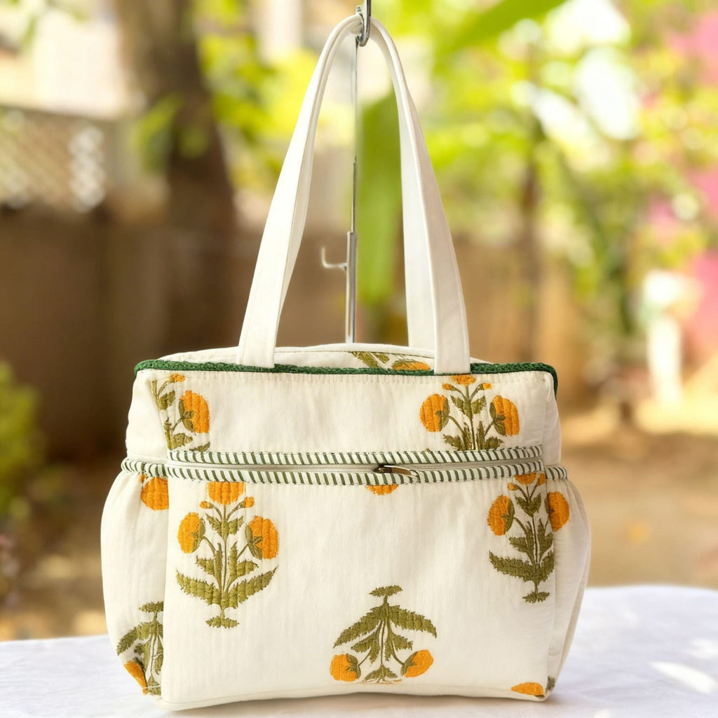 Yellow Floral Quilted Handbag by Suryatra