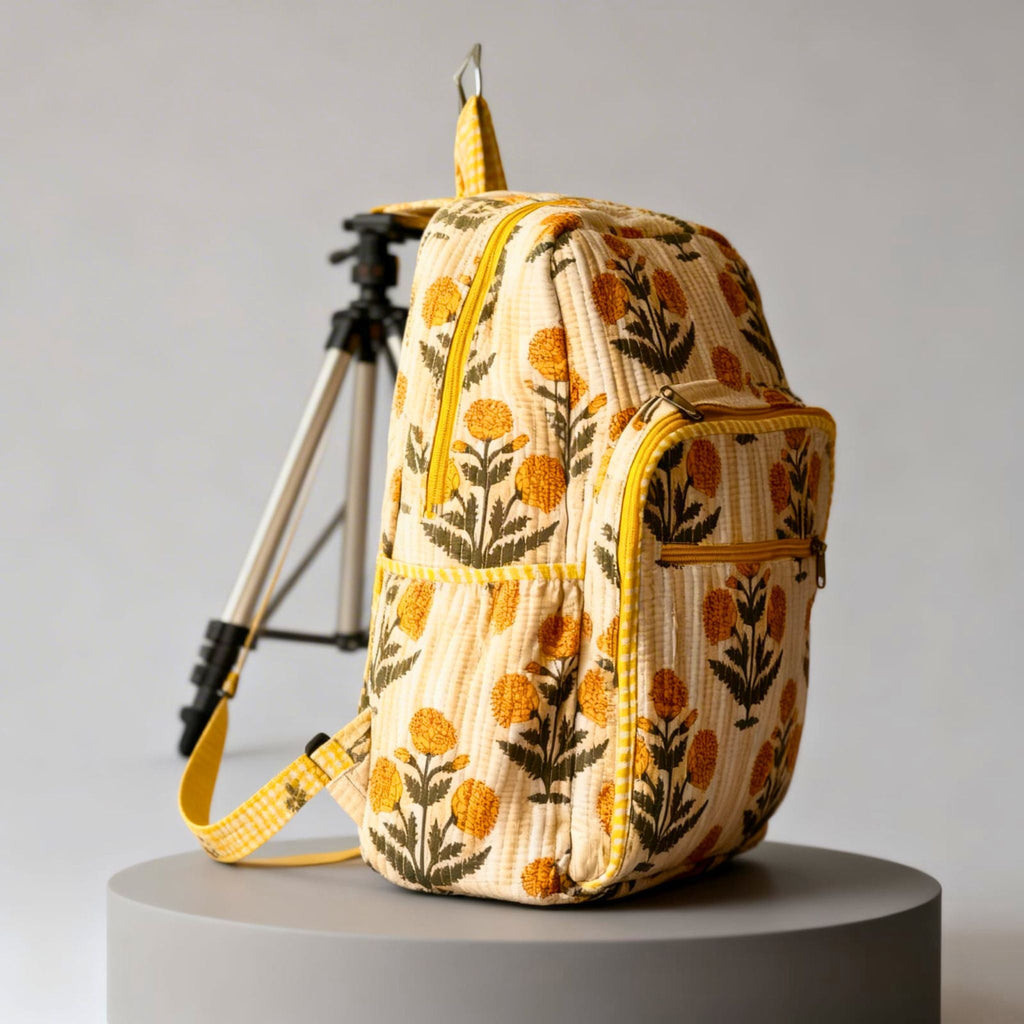 Yellow Floral Quilted Backpack by Suryatra