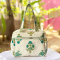 Green Floral Quilted Handbag by Suryatra