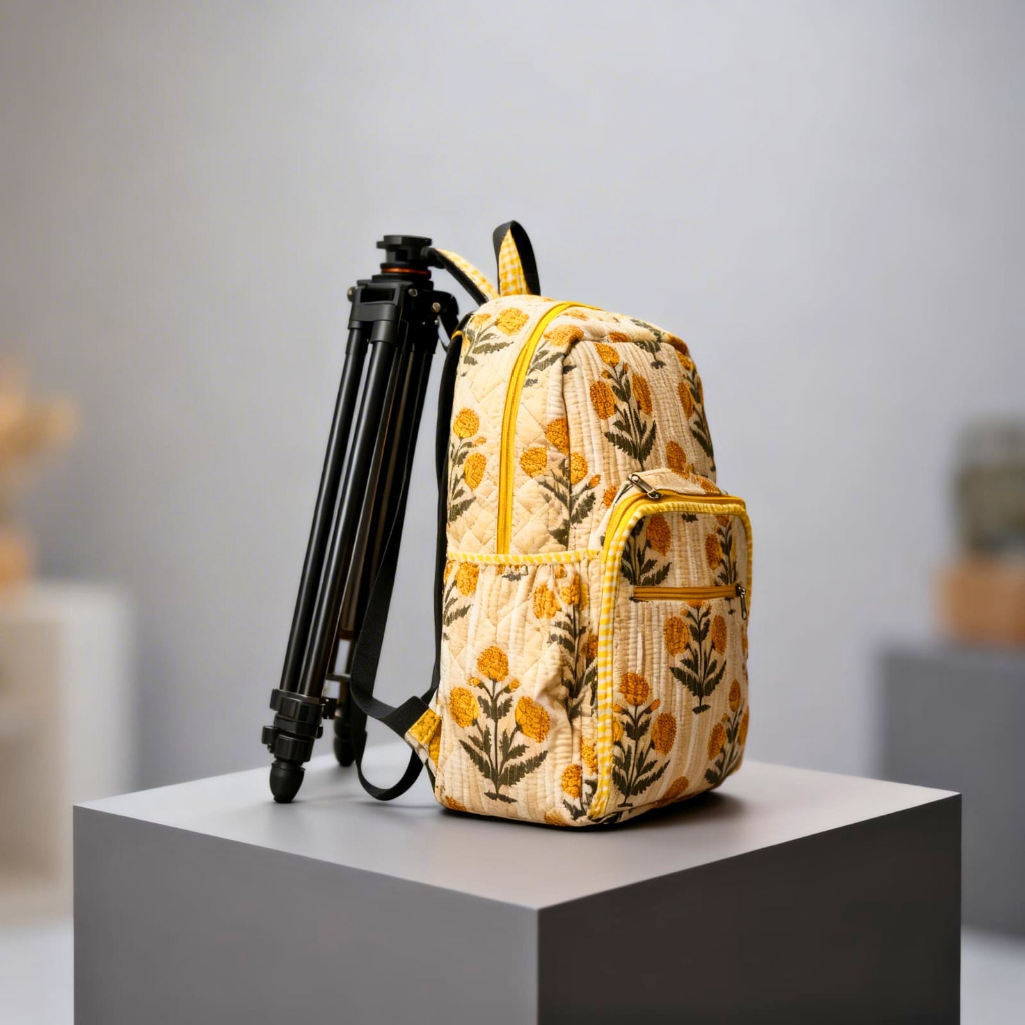 Yellow Floral Quilted Backpack by Suryatra